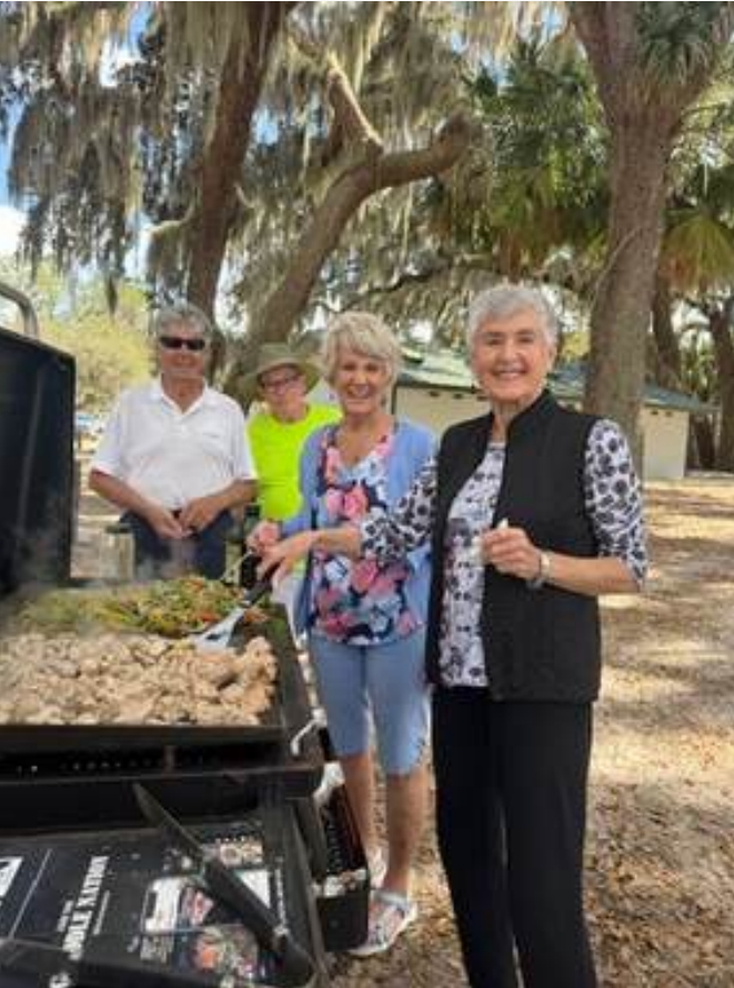 Randall C. with Howard R., Dale K., Peggy R. and Eileen M. grilling at Lake Weir