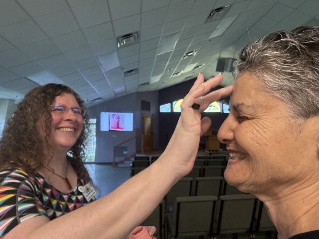 A glitter blessing being given.